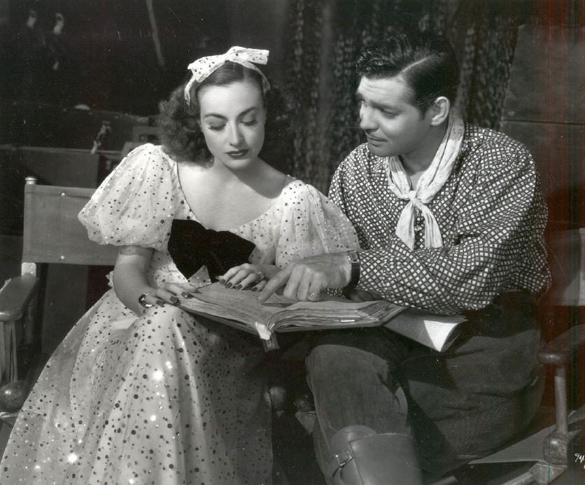 Joan Crawford and Clark Gable on the set of Love on the Run.